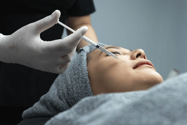 lose-up of Sculptra face filler treatment, enhancing facial contours and restoring volume